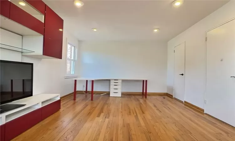 Unfurnished office featuring light wood-type flooring