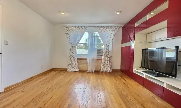 Unfurnished living room with light hardwood / wood-style flooring