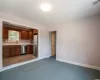 Bathroom with hardwood / wood-style floors, vanity, and walk in shower