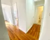 Corridor featuring hardwood / wood-style flooring