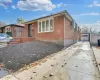 Single story home with a garage and an outbuilding