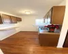 Kitchen featuring white gas stove and dark hardwood / wood-style flooring