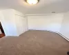 Unfurnished bedroom with carpet and a closet