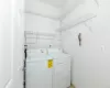 Laundry area with washing machine and clothes dryer