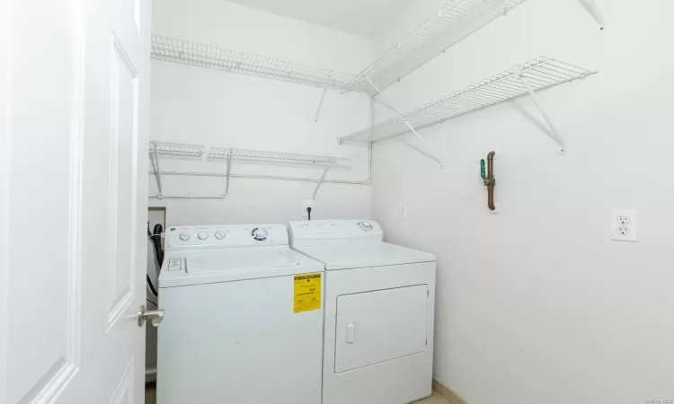 Laundry area with washing machine and clothes dryer