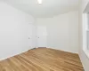 Spare room with light hardwood / wood-style floors and a healthy amount of sunlight