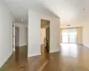 Kitchen featuring sink, stainless steel appliances, white cabinetry, and dark hardwood / wood-style floors