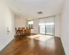 Unfurnished bedroom with multiple closets and dark hardwood / wood-style floors