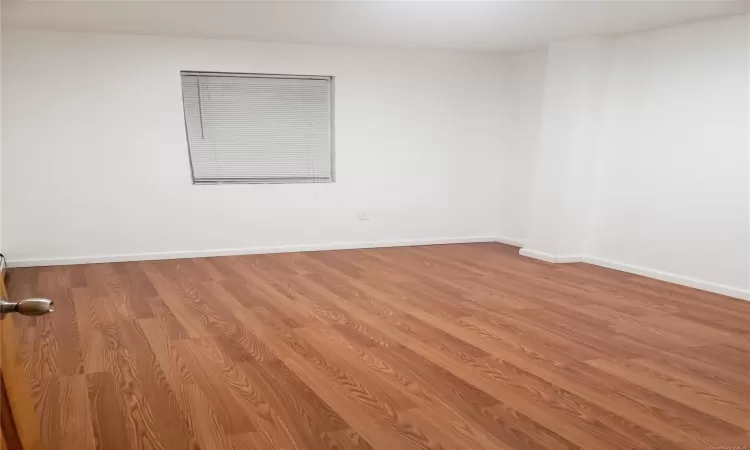 Spare room with light wood-type flooring