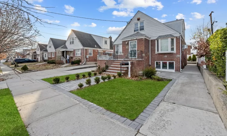 Bungalow-style house with a front yard