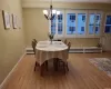 Bedroom featuring wood-type flooring and a wall unit AC