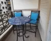 Dining space featuring a chandelier, a baseboard heating unit, and light hardwood / wood-style flooring