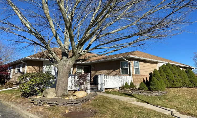 Front with new fence and patio