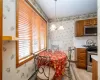 Tiled dining space with an inviting chandelier