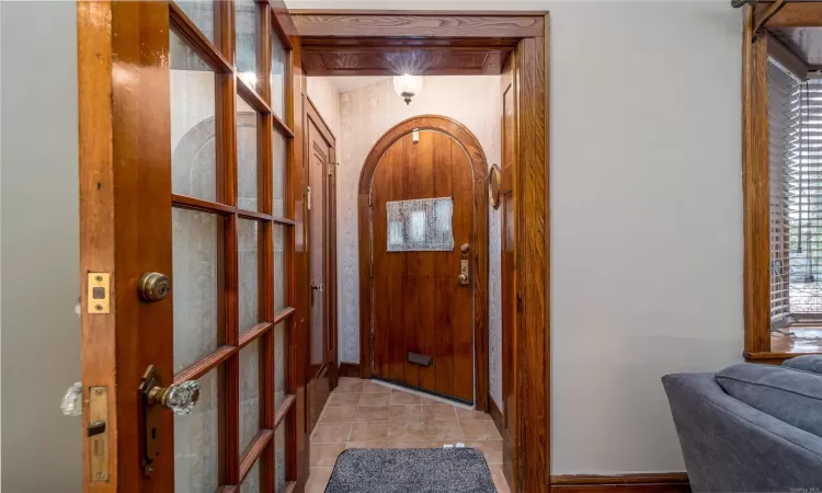 Entryway featuring light tile patterned floors