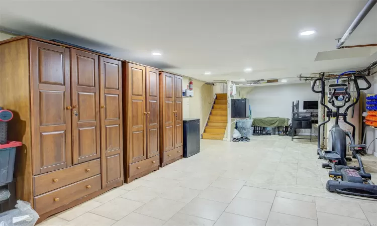 Basement featuring light tile patterned flooring