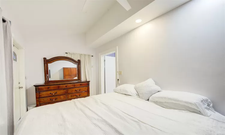 Bedroom featuring lofted ceiling