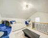 Bedroom featuring light hardwood / wood-style floors and lofted ceiling