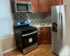 Bonus room featuring ceiling fan, radiator heating unit, carpet floors, and lofted ceiling