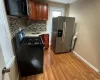 Empty room featuring radiator and wood-type flooring