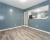 Unfurnished room featuring light wood-type flooring