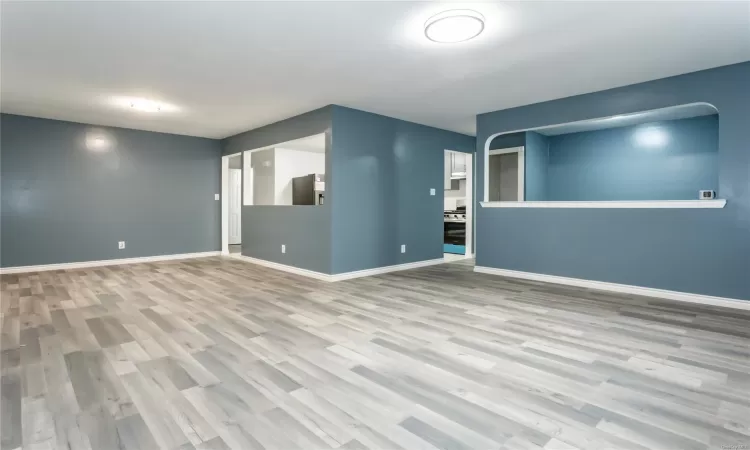 Unfurnished room featuring light wood-type flooring