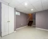 Basement featuring light tile patterned flooring