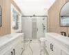 Bathroom featuring vanity, an enclosed shower, and toilet