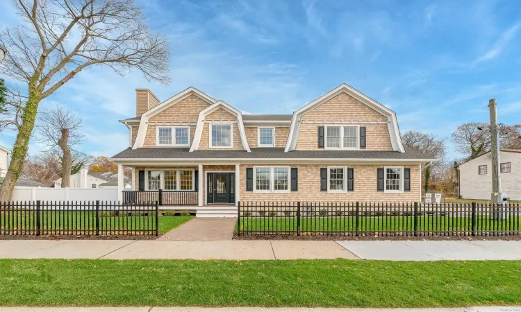 View of front of property featuring a front lawn