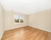 Unfurnished room with light hardwood / wood-style floors