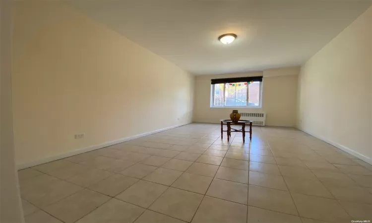 Unfurnished bedroom with light tile patterned floors and a closet