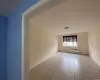 Corridor featuring light tile patterned floors