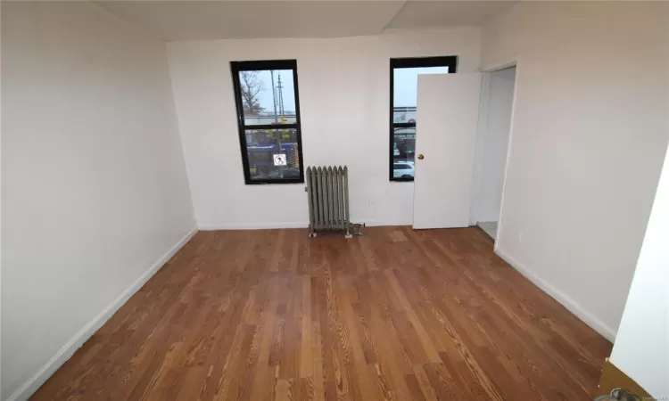 Hall with dark wood-type flooring