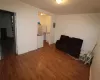 Bathroom with hardwood / wood-style floors, toilet, and sink