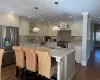 Kitchen with white cabinetry, visible vents, appliances with stainless steel finishes, and a sink