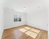 Living room featuring an inviting chandelier, high vaulted ceiling, and light wood-type flooring