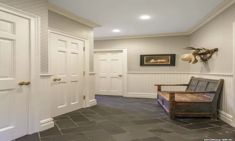 Mudroom with access to garage