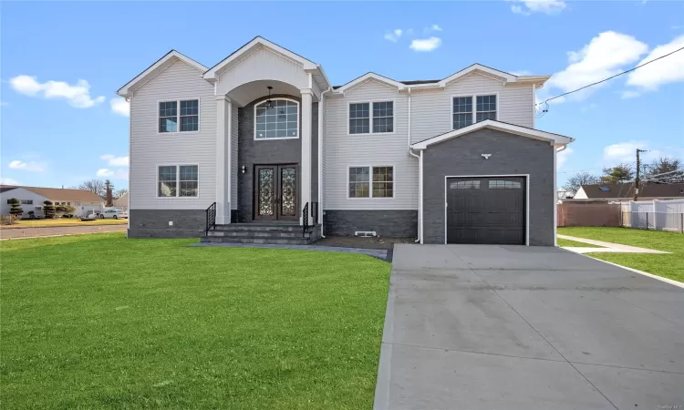 View of front of property with a front lawn