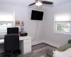 Bedroom W/Grey Wash Wide Plank Flooring.