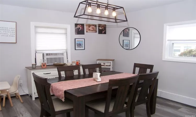 Dining Rm W/Grey Wash Wide Plank Flooring & Designer Chandelier