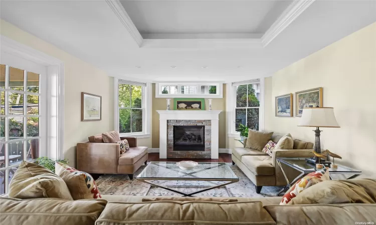 Living room with gas fireplace and doors to front porch