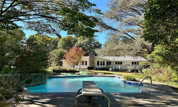 Ranch-style house featuring a front lawn