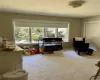 Empty room featuring light parquet floors, a baseboard radiator, and a notable chandelier