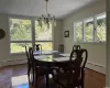 Unfurnished living room with a baseboard radiator and a stone fireplace