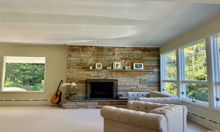 Spare room with baseboard heating, an inviting chandelier, and parquet floors