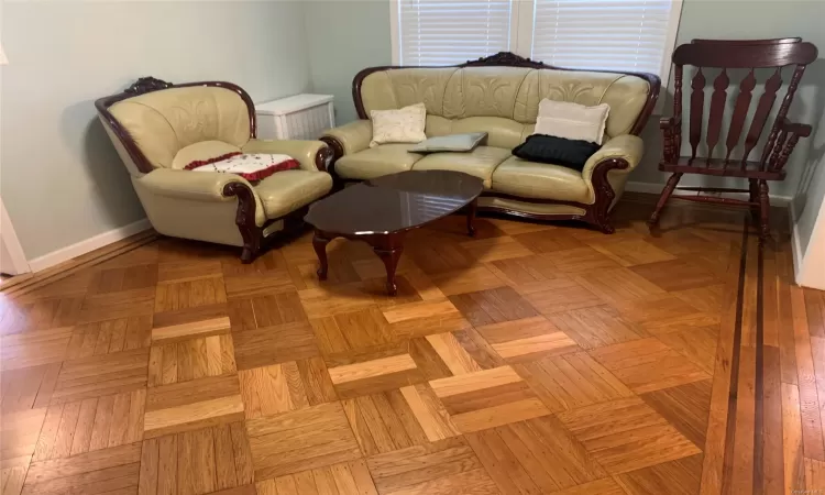 Living area featuring light parquet flooring