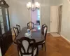 Dining room featuring parquet floors and a chandelier