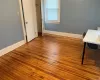 Unfurnished bedroom with hardwood / wood-style floors