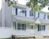 View of front of home featuring a porch and a garage