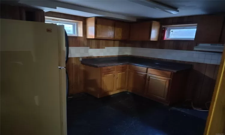 Kitchen with white fridge and tasteful backsplash